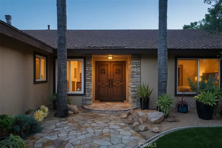 Welcoming courtyard with custom double doors