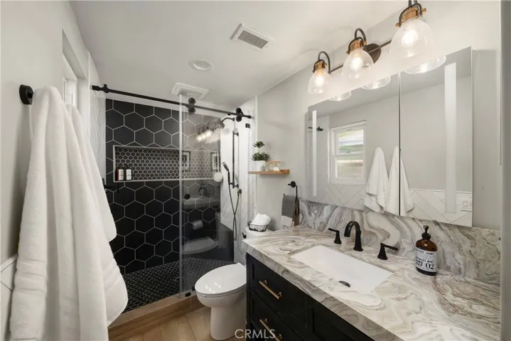Designer bathroom with custom tile and luxury finishes