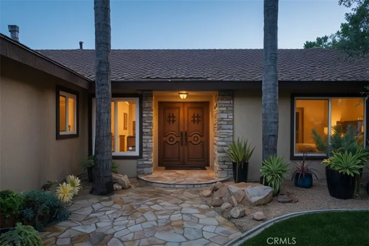 Welcoming courtyard with custom double doors