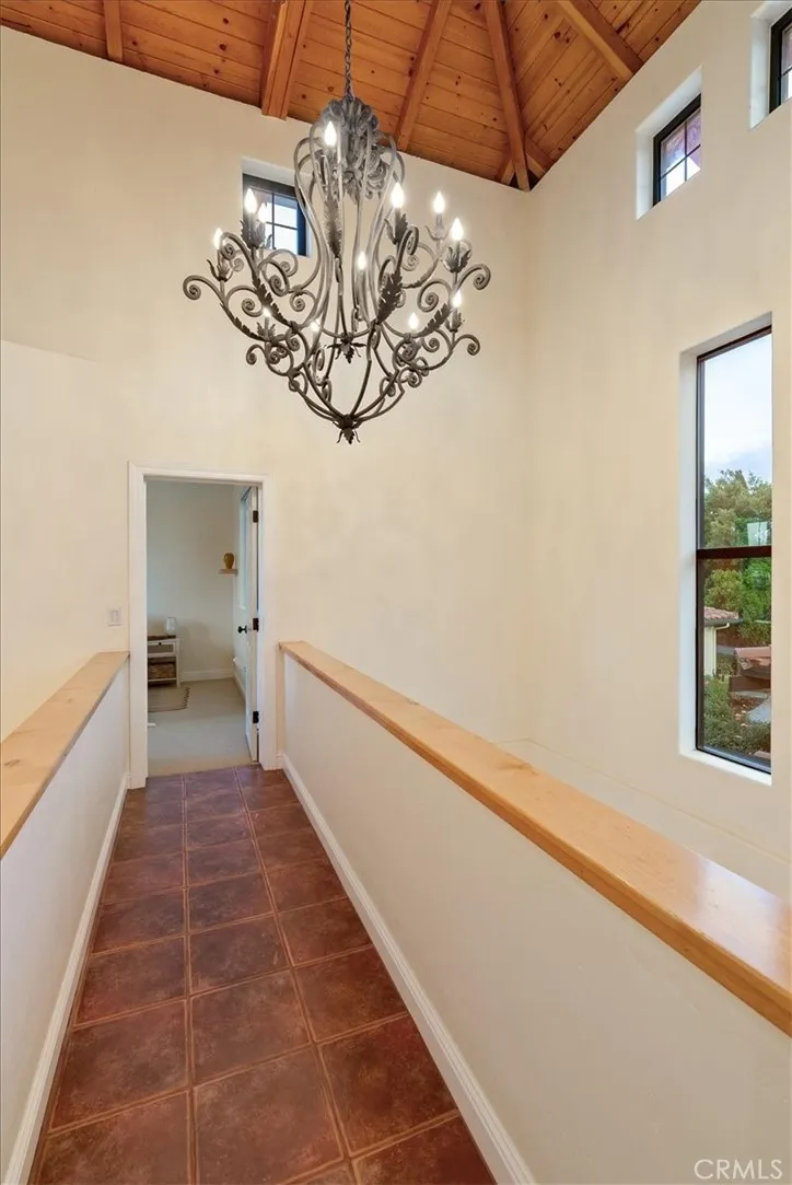 ...dramatic upper hallway connects...