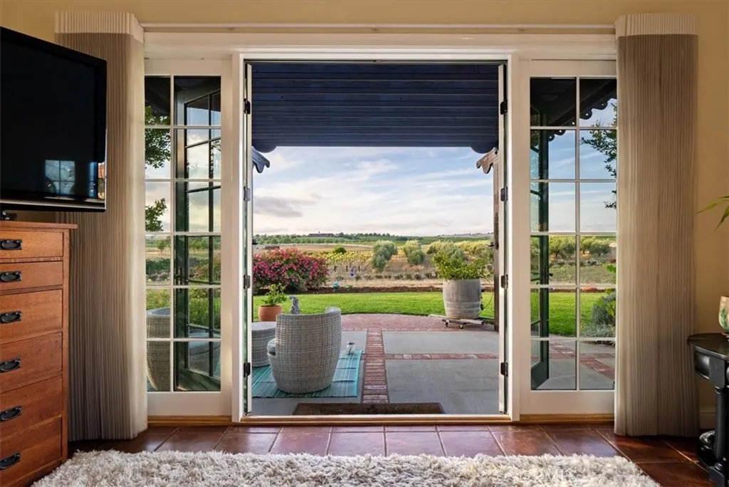 ...double doors open to a private patio...