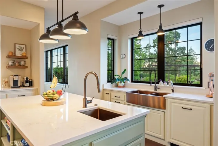 ...vegetable and farmhouse sinks set in Quartz countertops...