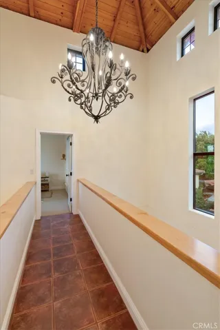 ...dramatic upper hallway connects...