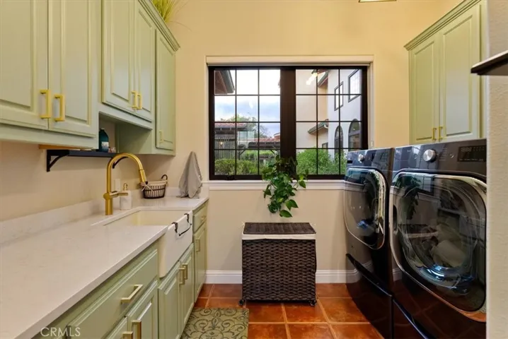...Laundry room with deep sink and great storage capacity...