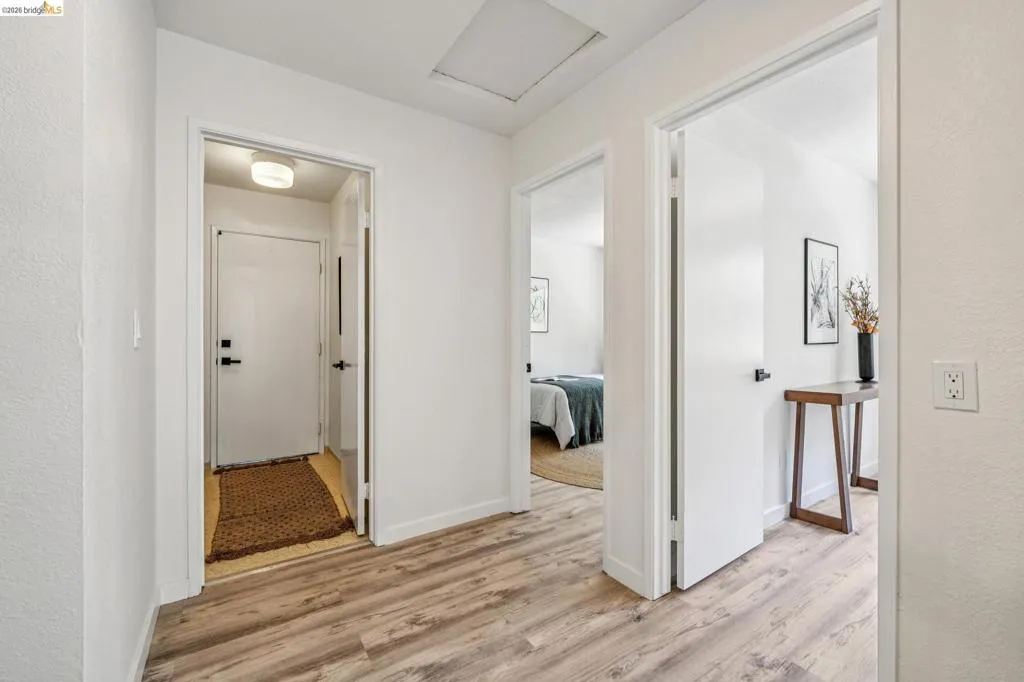 Neutral color palette throughout featuring wood-finish flooring
