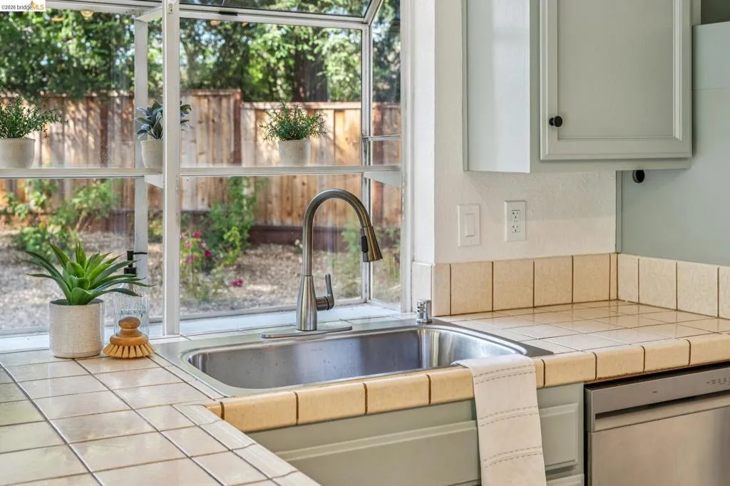 Stainless steel sink with a gooseneck faucet