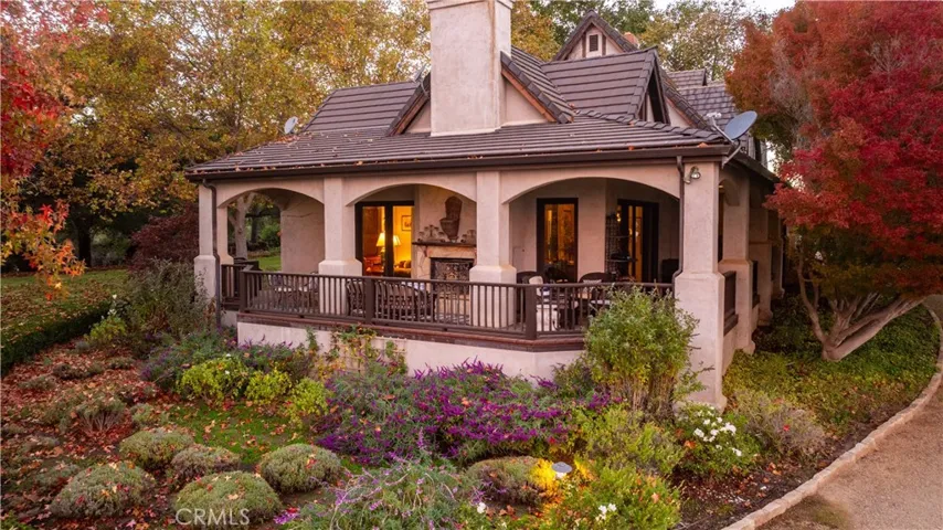 Large covered patio with wood burning fireplace.