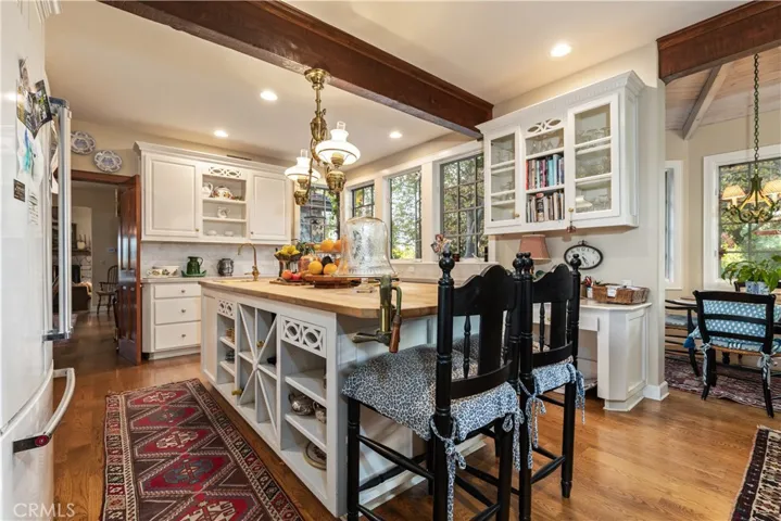 Lots of cabinets and counter space with bar-stool seating.