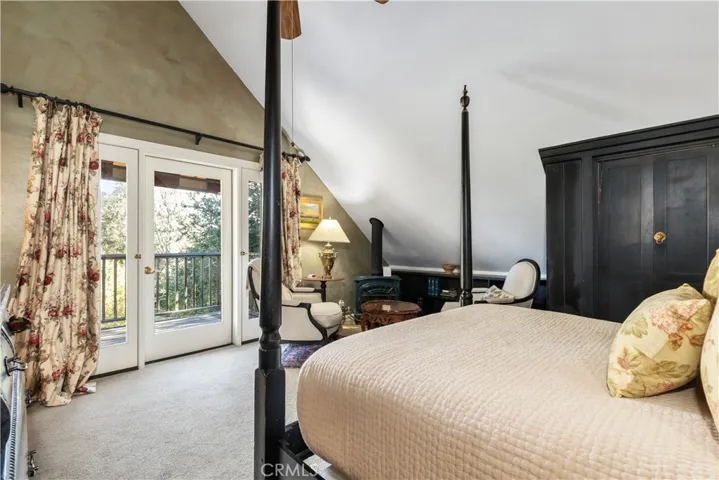 Second guest room with ensuite bathroom and French doors to its own private balcony.