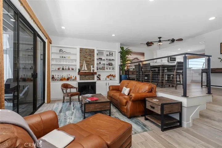 Living room w/fireplace and balcony access.