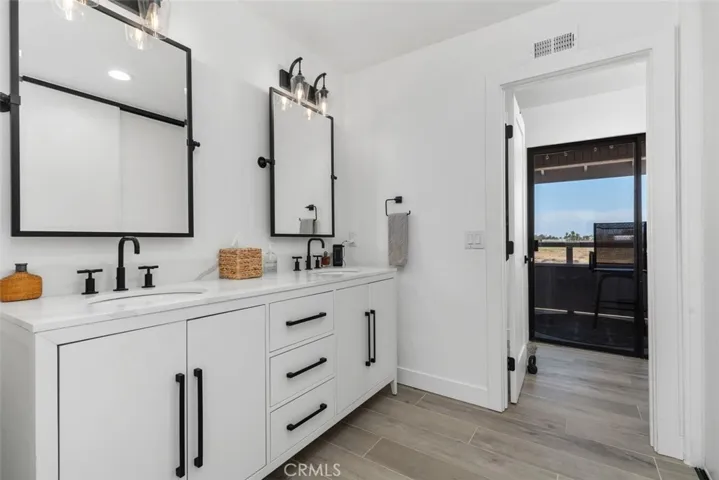 Upgraded Primary Bathroom with Dual Vanities.