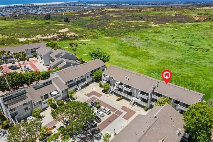 This photo has been digitally enhanced for a greener open space. this shows the very private location while displaying the kitchen view as well as the third balcony view facing the Randall preserve and the coastline while also allowing you to catch amazing sunsets.