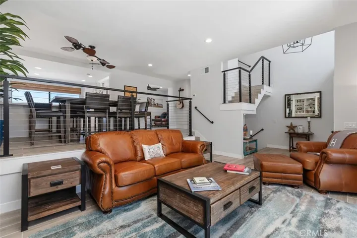 Living and Dining with direct access to the garage going down at the stairs.