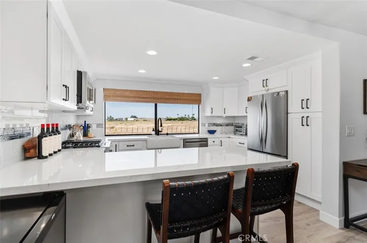 Large Granite Countertops with the Kitchen looking out to the Randall Preserve and beyond.
