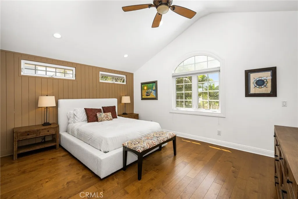 One of the 4 bedrooms upstairs..High ceiling and recessed lights and windows.