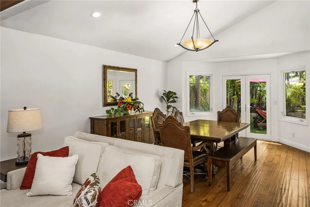 Next to the Kitchen -family room sitting area. recessed lights- door leading to the 2 car garage.