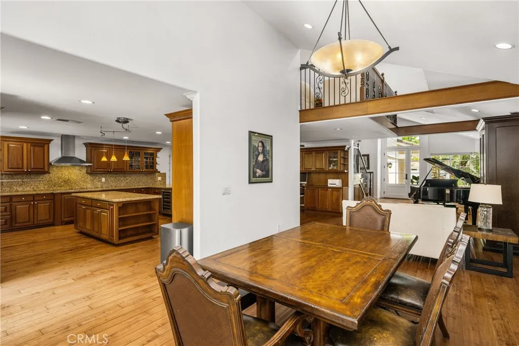 From the Formal dining room with the Chandelier lookinf out to the front room and the kitchen
