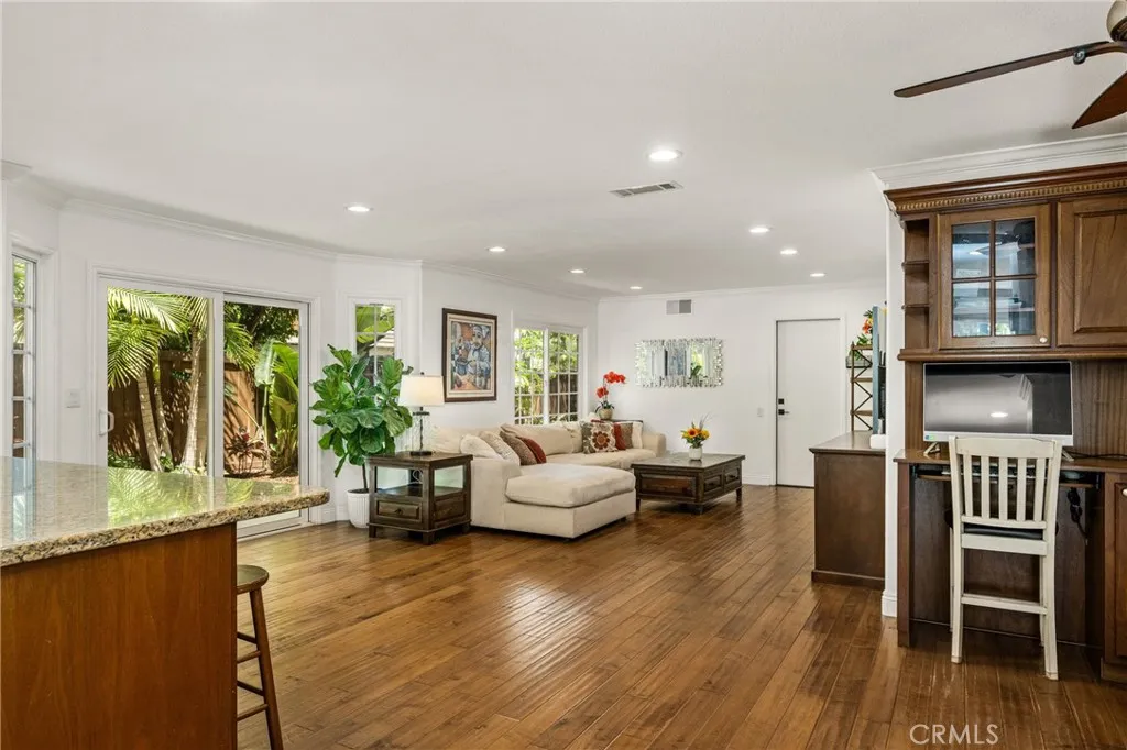 Next to the Kitchen -family room sitting area. recessed lights- door leading to the 2 car garage.
