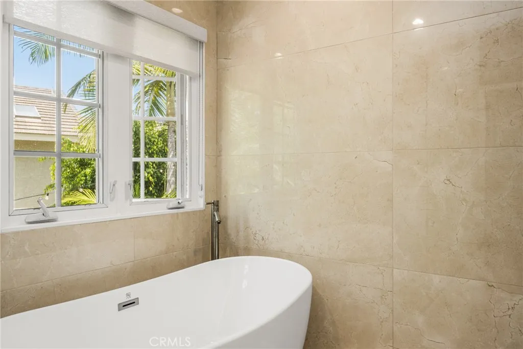 Master bedroom, high ceilings, ceiling fan, recessed lights. with private bath room-separate tub and stall shower.