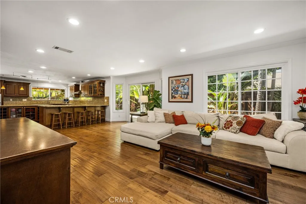 Next to the Kitchen -family room sitting area. recessed lights- door leading to the 2 car garage.