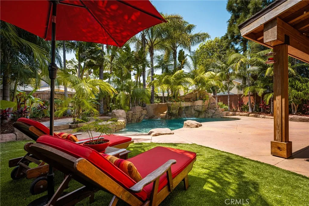 Sitting outside looking the beautiful Private swimming pool and the lush landscape..