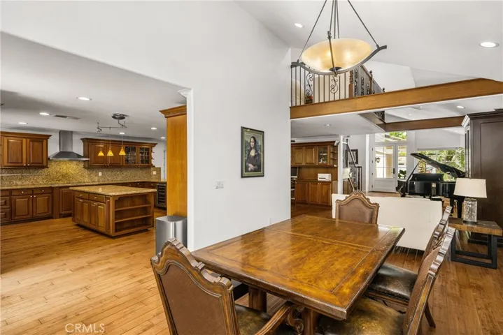From the Formal dining room with the Chandelier lookinf out to the front room and the kitchen