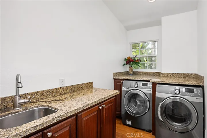 Upstairs utility room with separate cusome sink...