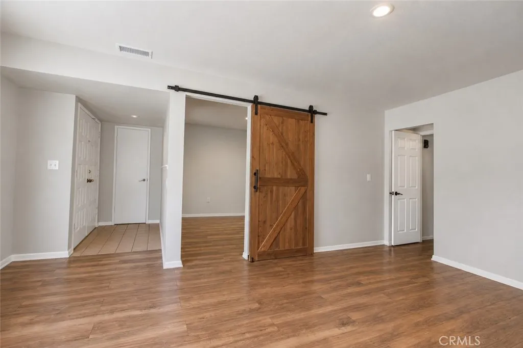 Living area with view of front entrance and bonus room