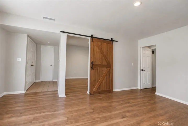 Living area with view of front entrance and bonus room
