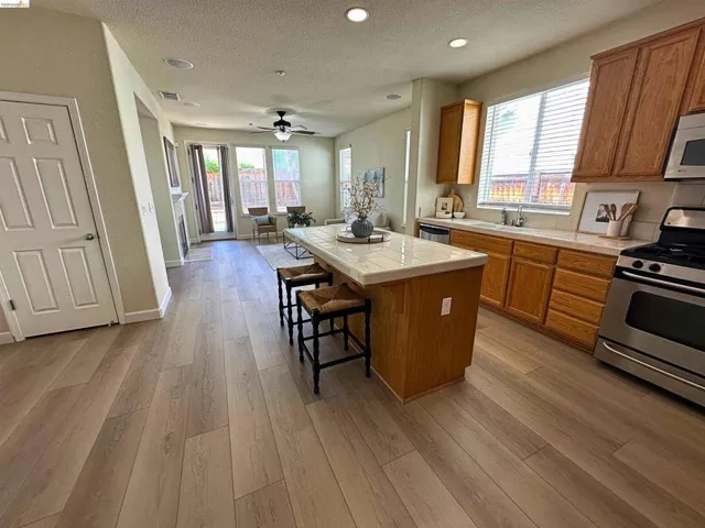 Expansive wood-finish flooring throughout
