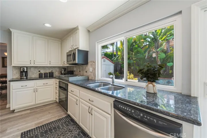 Kitchen views overlooking tropical backyard