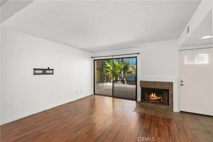 nice wood plank flooring with fireplace