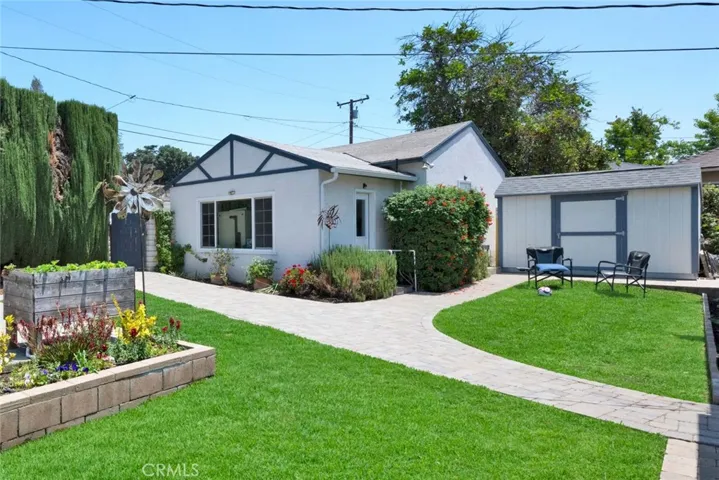 Service room with washer dryer and LOTS of storage, garage with alley access attached to it.
