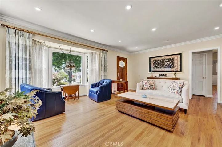 Gleaming pecan colored hardwood floors in this warm and tranquil home