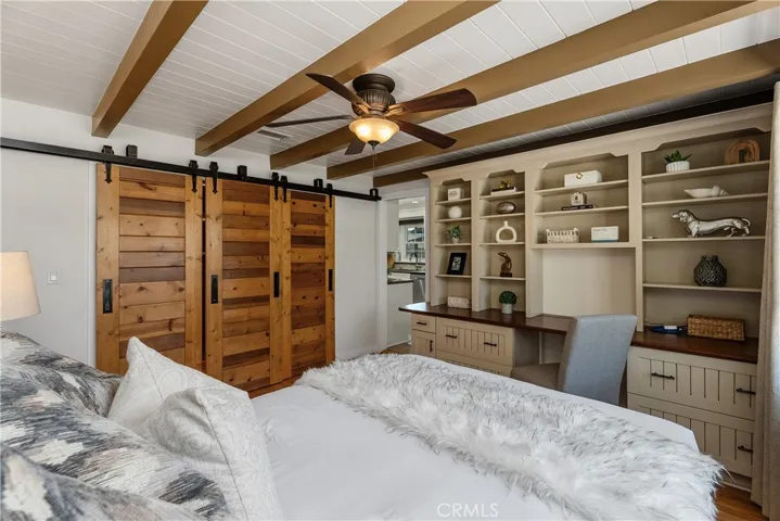 This spacious front bedroom could live beautifully as a primary-style retreat, home office, or creative space, with handcrafted details that make it one of the home’s most memorable rooms.