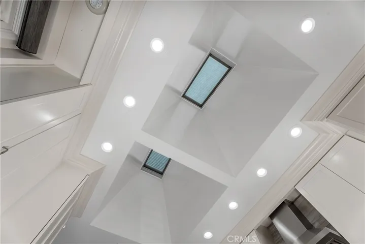 Two remote-controlled skylights fill the kitchen with natural light and fresh air, complete with built-in screens and rain sensors that automatically close when weather changes.