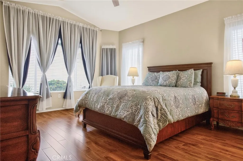 Primary Bedroom with beautiful flooring and windows.