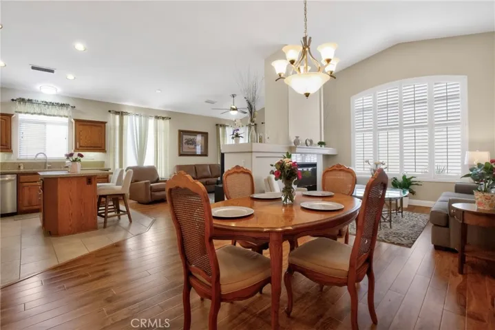 Dining Area/Living Room with shutters and dual fireplace