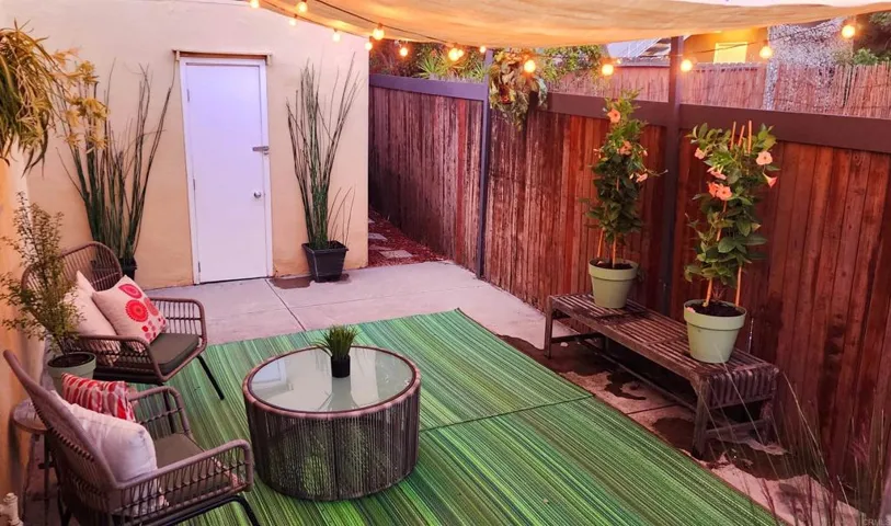 The backyard is covered with awnings for shade, while still allowing light in.