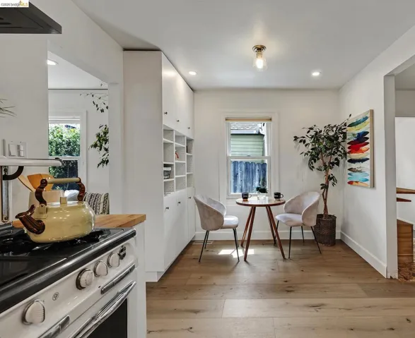 Light wood-finish flooring extending through an open-concept living area