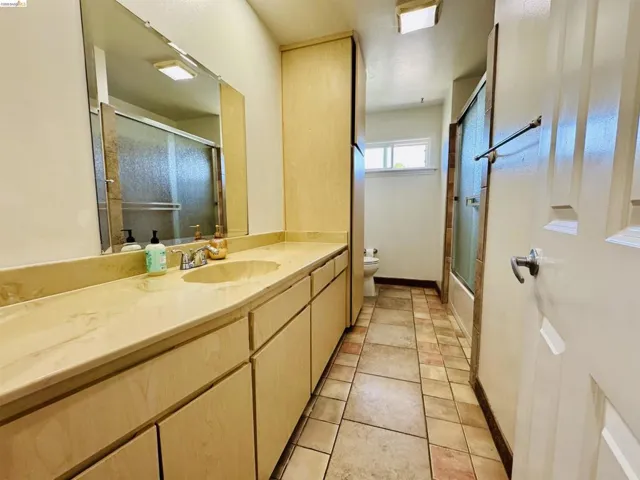 Extended vanity with integrated sink and chrome faucet