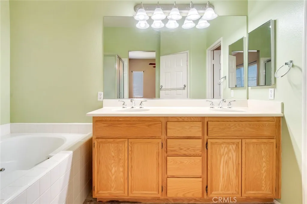 Primary Bathroom with Dual Sinks and Storage