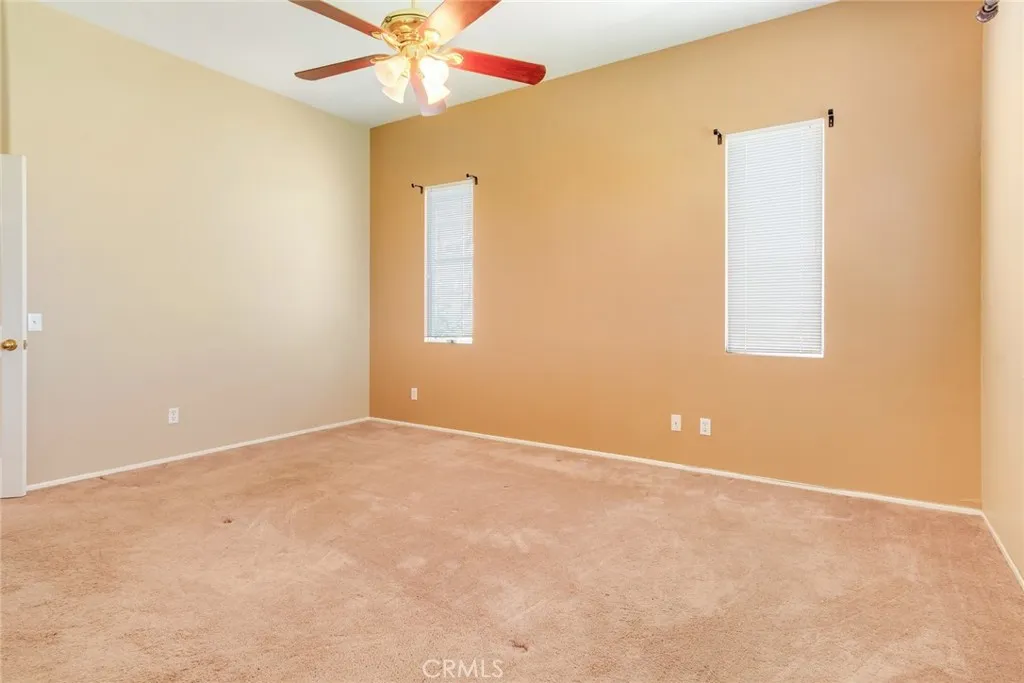 Primary Bedroom with a High Ceiling