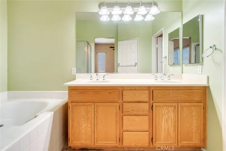 Primary Bathroom with Dual Sinks and Storage
