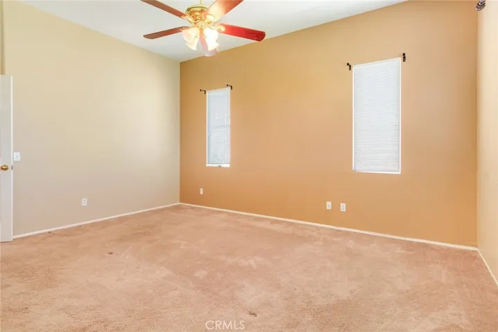 Primary Bedroom with a High Ceiling