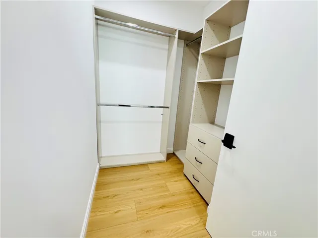 Walk in closet with closet systems