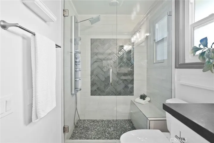 Remodeled primary shower with spa fixture