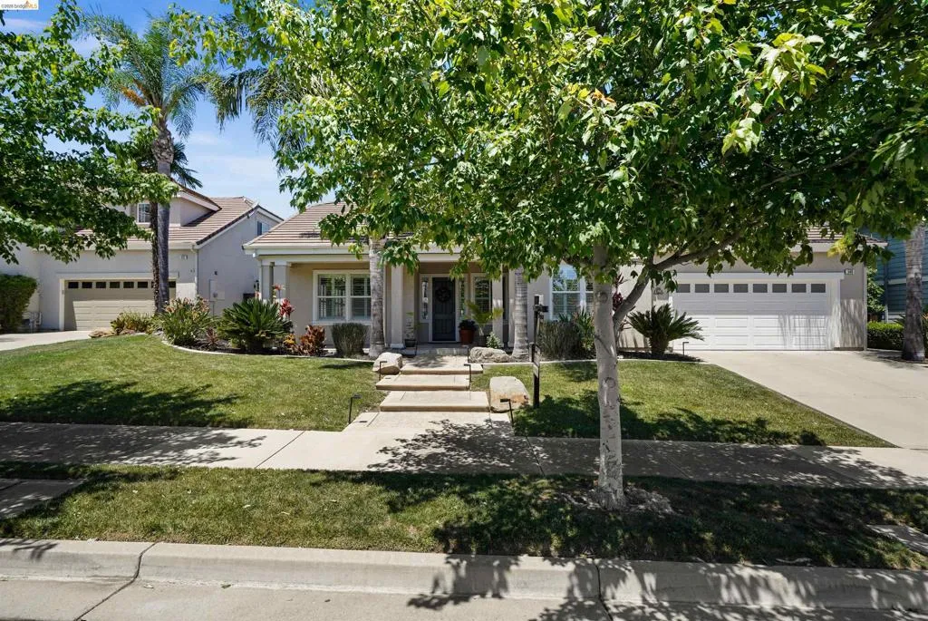 Single-story residence featuring a stucco exterior and a front-facing garage