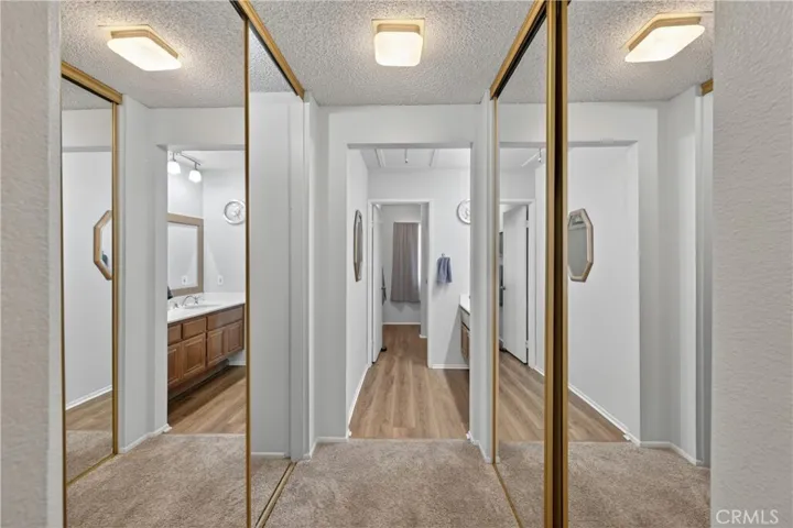 Two closets (one is walk in) in primary bedroom