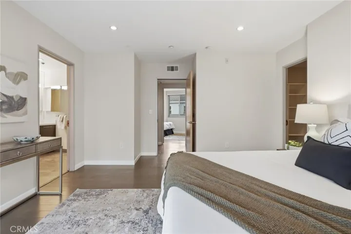 Primary bedroom with ensuite bathroom and large walk-in closet